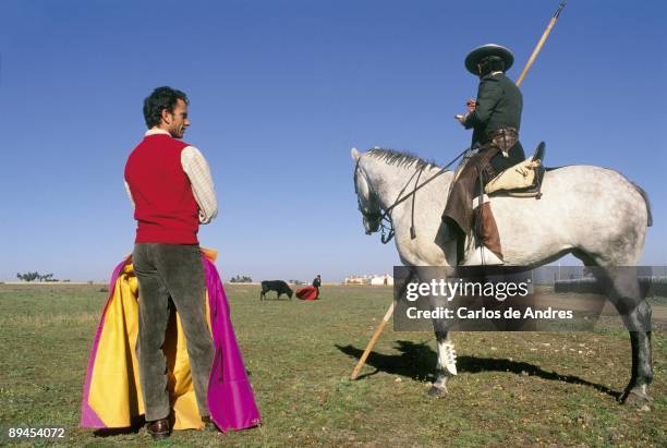 Julio Aparicio next to a picador Bullfighting in the country state with horses and garrochas