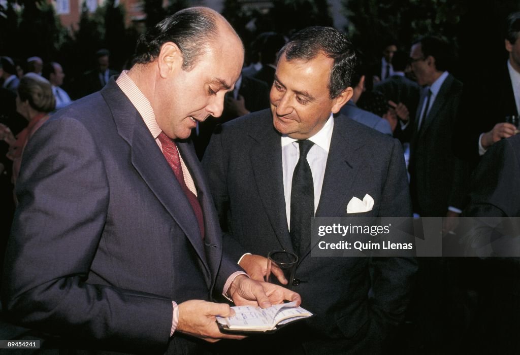 Juan Abello and Juan March, bankers Juan Abello looking in a notebook beside Juan March