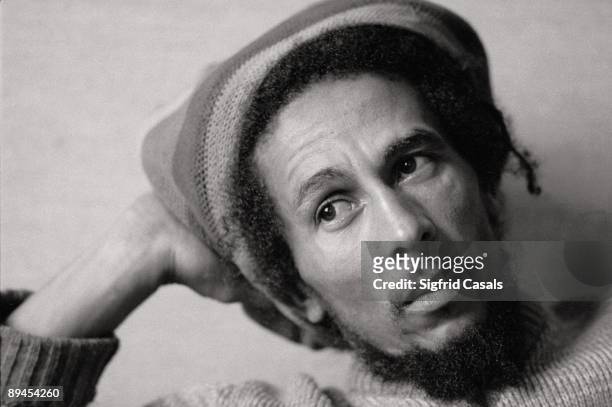 Bob Marley, singer The singer sat with a Jamaican cap