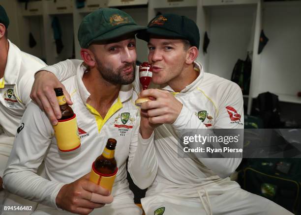 Nathan Lyon and Tim Paine of Australia of Australia celebrate in the changerooms after Australia regained the Ashes during day five of the Third Test...