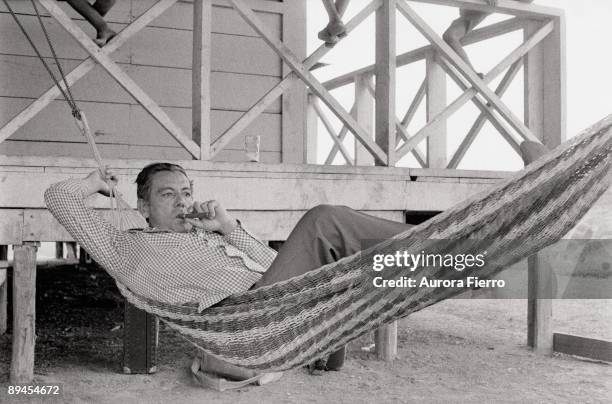 Omar Torrijos, President of Panama Torrijos lying in a hammock and smoking a cigar