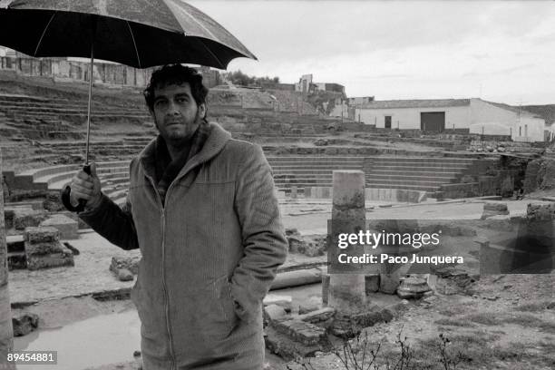 Placido Domingo, tenor, in Italica ruins The tenor with an umbrella in the ruins of the Roman theater
