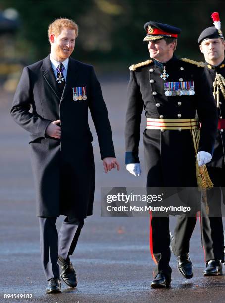 Prince Harry accompanied by Major General Paul Nanson attends The Sovereign's Parade at the Royal Military Academy Sandhurst on December 15, 2017 in...