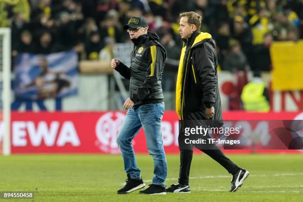 Head coach Peter Stoeger of Dortmund and Assistant coach Joerg Heinrich of Dortmund look on after the Bundesliga match between 1. FSV Mainz 05 and...