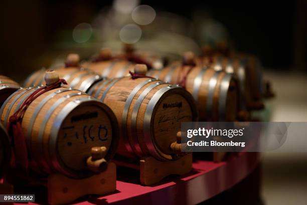 Barrels containing beverages stand inside Pavilion, a restaurant operated by Smiles Co., in Tokyo, Japan, on Tuesday, Jan. 24, 2017. Masamichi...
