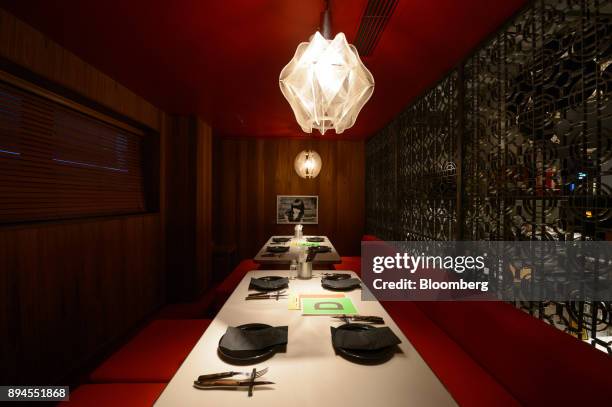 Dinnerware and cutlery sit on tables inside Pavilion, a restaurant operated by Smiles Co., in Tokyo, Japan, on Tuesday, Jan. 24, 2017. Masamichi...