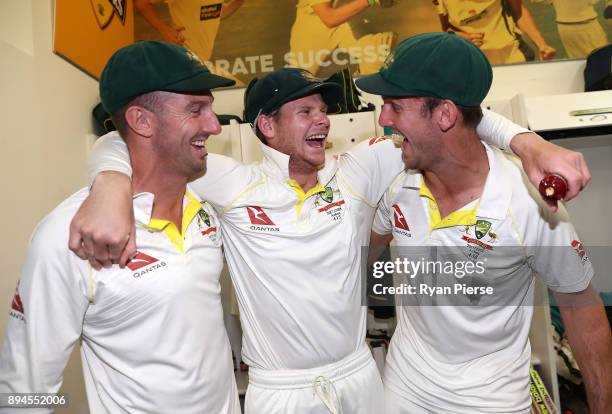 Shaun Marsh, Steve Smith and Mitch Marsh of Australia celebrate in the changerooms after Australia regained the Ashes during day five of the Third...