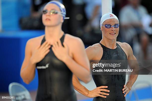 France's Aurore Mongel looks at Great Britain's Ellen Gandy during the women's 200m butterfly semi-final on July 29, 2009 at the FINA World Swimming...