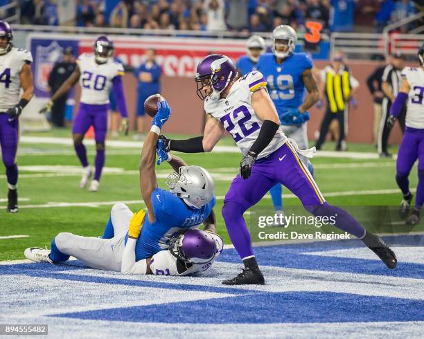 Darren Fells of the Detroit Lions appears to score a touchdown over Tramaine Brock of the Minnesota Vikings that was later overturned on a review...