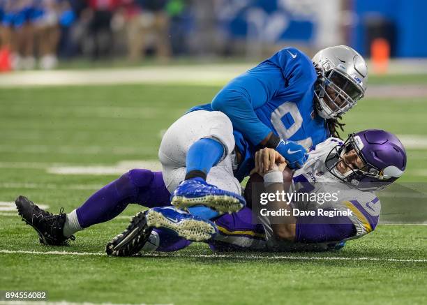 Ezekiel Ansah of the Detroit Lions sacks quarterback Case Keenum of the Minnesota Vikings during the second half during an NFL game at Ford Field on...