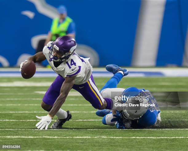 Stefon Diggs of the Minnesota Vikings is tackled by Darius Slay of the Detroit Lions during an NFL game at Ford Field on November 23, 2016 in...
