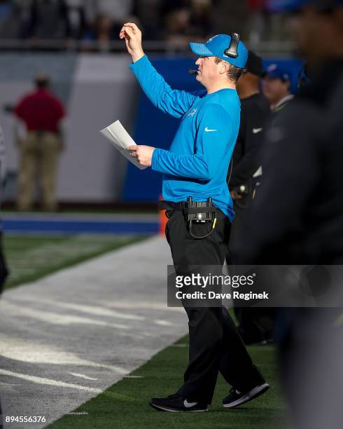 Offensive Coordinator Jim Bob Cooter of the Detroit Lions walks the side lines during an NFL game against the Minnesota Vikings at Ford Field on...