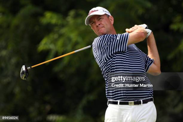 Davis Love III hits a shot during the second round of the AT&T National hosted by Tiger Woods at Congressional Country Club on July 3, 2009 in...