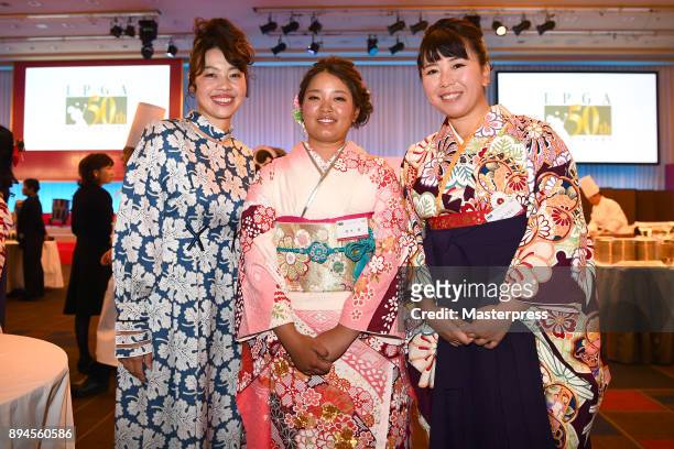 Yukari Nishiyama, Ai Suzuki and Yumiko Yoshida of Japan smile during the LPGA Awards and the 50th anniversary ceremony of the Japanese LPGA...