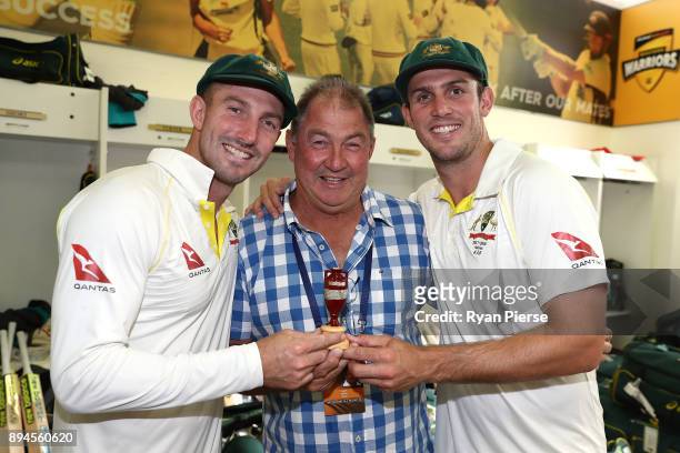 Shaun Marsh and Mitch Marsh of Australia pose with their father and former Australian Test Cricketer Geoff Marsh as they celebrate in the changerooms...