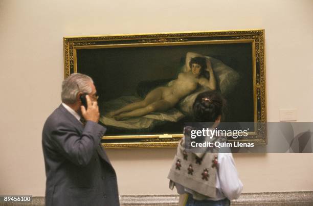 Visitors beside Goya´s 'The Naked Maja', Prado Museum