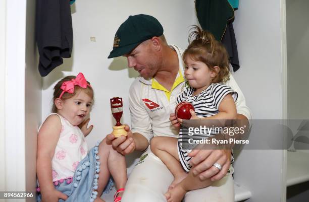 David Warner of Australia and his daughters Ivy and Indi celebrate in the changerooms after Australia regained the Ashes during day five of the Third...