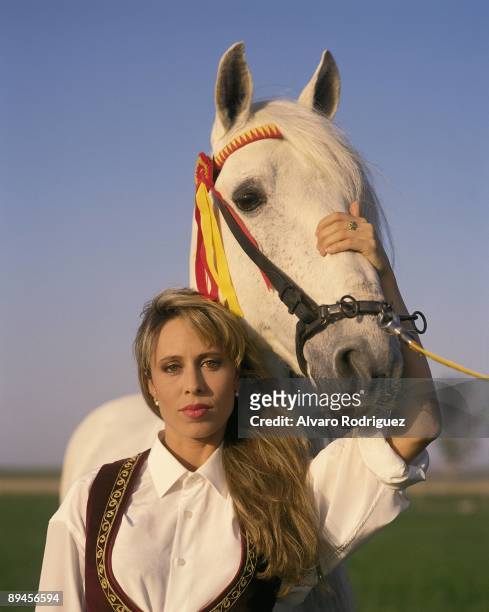 Miriam Diaz Aroca, actress and TV presenter Next to a horse