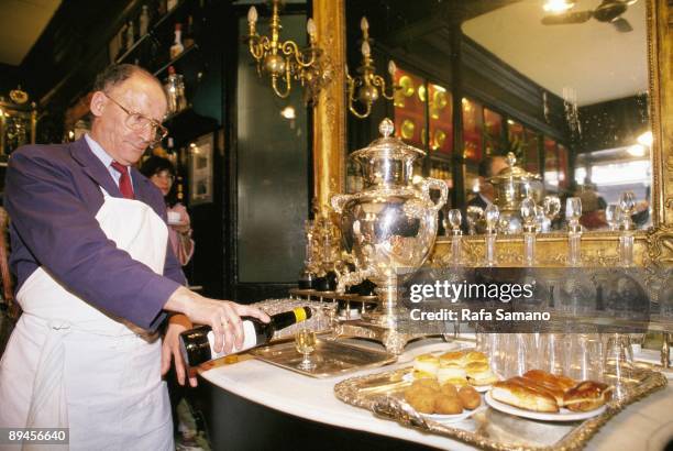 Lhardy Bar, Madrid Waiter serving a cup of wine