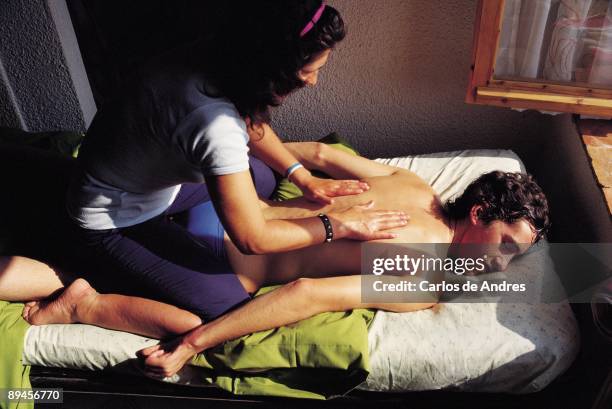 Massage therapy in a center of rehabilitation A young man receives a therapeutic massage in a center of drug addicts rehabilitation