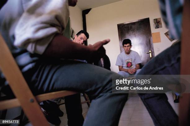 Group therapy in a rehabilitation center Young men entered in the recovery center of junkie Project Man carrying out a group therapy
