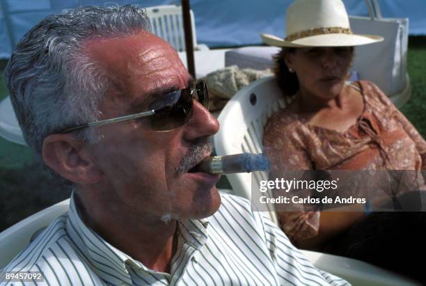 Cent ro Hipico Casa Novas. Carballo. La Coruna. Spain International horse competition. Man smoking a cigars.