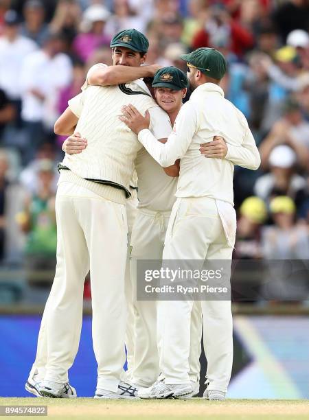 Steve Smith of Australia celebrates after Pat Cummins of Australia claimed the final wicket of Chris Woakes of England to claim victory during day...