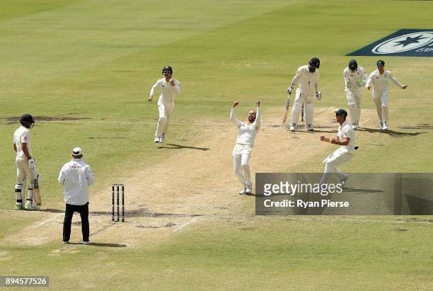 Nathan Lyon of Australia celebrates after taking the wicket of Moeen Ali of England during day five of the Third Test match during the 2017/18 Ashes...