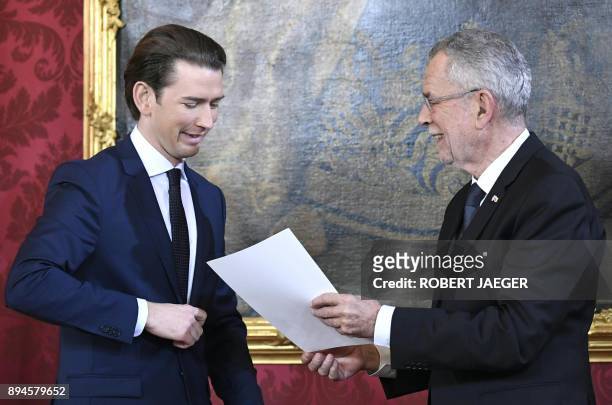 Austrian President Alexander Van der Bellen hands over the letter of appointment to Austrian Chancellor of the conservative People's Party Sebastian...