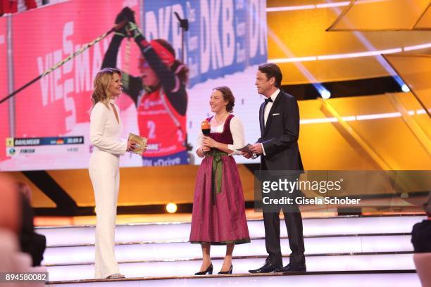 Katrin Mueller-Hohenstein, Biathlete Laura Dahlmeier with award and Rudi Cerne during the 'Sportler des Jahres 2017' Gala at Kurhaus Baden-Baden on...