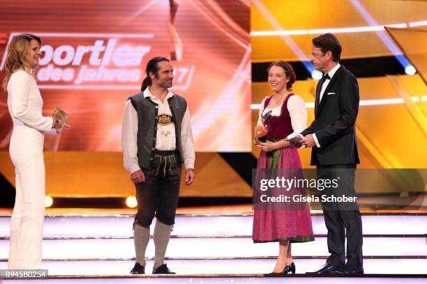 Katrin Mueller-Hohenstein, Alexander Huber, Biathlete Laura Dahlmeier with award and Rudi Cerne during the 'Sportler des Jahres 2017' Gala at Kurhaus...