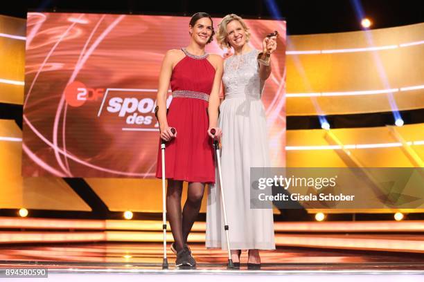 Kira Walkenhorst and her beach volleyball team mate Laura Ludwig with award best team during the 'Sportler des Jahres 2017' Gala at Kurhaus...