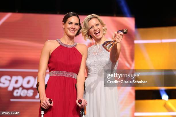 Kira Walkenhorst and her beach volleyball team mate Laura Ludwig with award best team during the 'Sportler des Jahres 2017' Gala at Kurhaus...