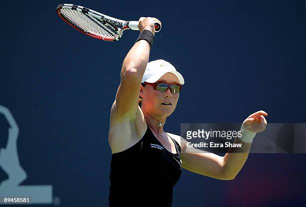 Samantha Stosur of Australia returns a shot to Monica Niculescu of Romania during their match on Day 3 of the Bank of the West Classic at Stanford...