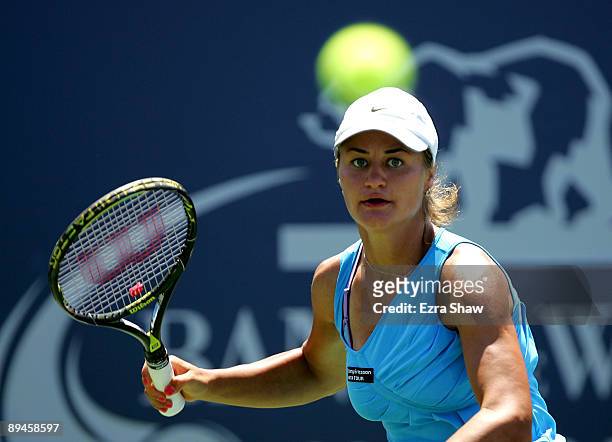 Monica Niculescu of Romania returns a shot to Samantha Stosur of Australia during their match on Day 3 of the Bank of the West Classic at Stanford...