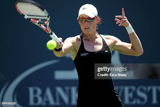 Samantha Stosur of Australia returns a shot to Monica Niculescu of Romania during their match on Day 3 of the Bank of the West Classic at Stanford...