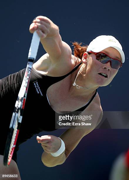 Samantha Stosur of Australia serves to Monica Niculescu of Romania during their match on Day 3 of the Bank of the West Classic at Stanford University...