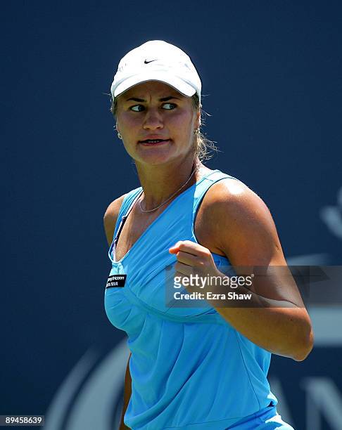 Monica Niculescu of Romania reacts after winning a point in her match against Samantha Stosur of Australia on Day 3 of the Bank of the West Classic...