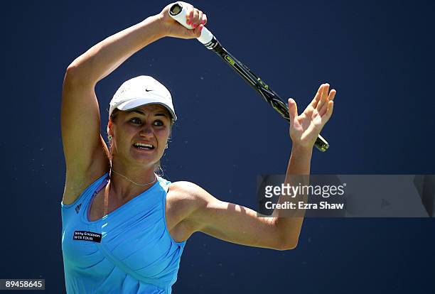 Monica Niculescu of Romania returns a shot to Samantha Stosur of Australia during their match on Day 3 of the Bank of the West Classic at Stanford...