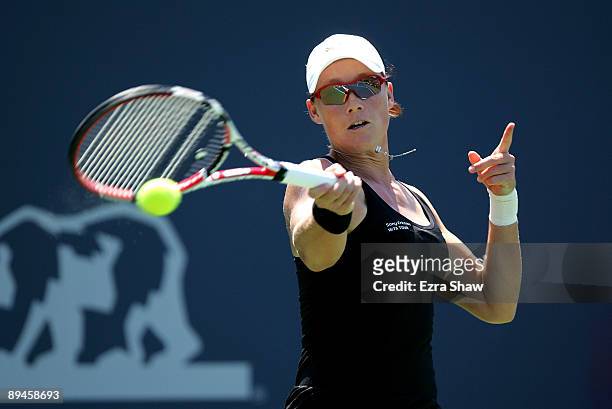 Samantha Stosur of Australia returns a shot to Monica Niculescu of Romania during their match on Day 3 of the Bank of the West Classic at Stanford...