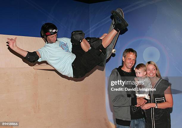 Former professional skateboarder Tony Hawk, his daughter Kadence Hawk and wife Lhotse Merriam attend the unveiling of his wax figure at Madame...