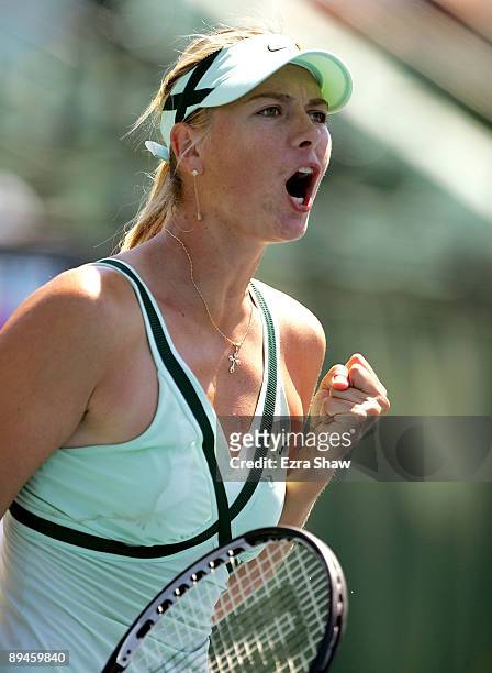 Maria Sharapova of Russia celebrates after beating Nadia Petrova of Russia on Day 3 of the Bank of the West Classic at Stanford University on July...