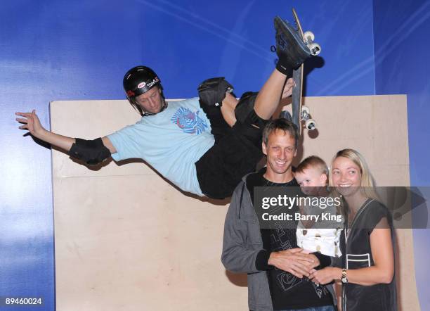 Former professional skateboarder Tony Hawk with his wife Lhotse Merriam and their daughter Kadence Clover Hawk attend the unveiling of Hawk's wax...