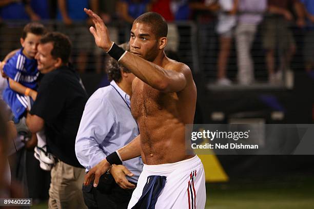 Oguchi Onyewu of AC Milan waves to the crowd against Chelsea FC at M & T Bank Stadium on July 24, 2009 in Baltimore, Maryland.