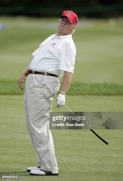 Donald Trump watches his putt at the ninth green during the Pro-Am round of the Deutsche Bank Championship held at TPC Boston on August 28, 2008 in...