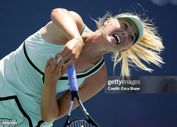 Maria Sharapova of Russia serves to Nadia Petrova of Russia on Day 3 of the Bank of the West Classic at Stanford University on July 29, 2009 in...