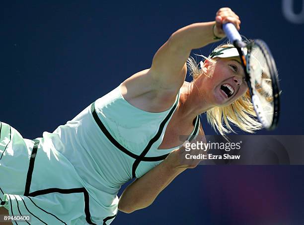 Maria Sharapova of Russia serves to Nadia Petrova of Russia on Day 3 of the Bank of the West Classic at Stanford University on July 29, 2009 in...
