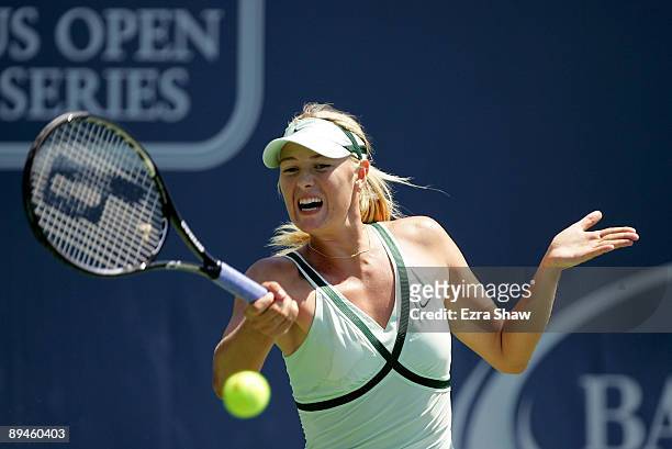 Maria Sharapova of Russia returns a shot to Nadia Petrova of Russia on Day 3 of the Bank of the West Classic at Stanford University on July 29, 2009...