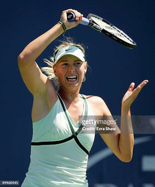 Maria Sharapova of Russia returns a shot to Nadia Petrova of Russia on Day 3 of the Bank of the West Classic at Stanford University on July 29, 2009...