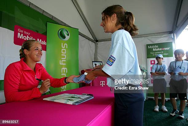 Sabine Lisicki of Germany signs autographs on Day 3 of the Bank of the West Classic at Stanford University on July 29, 2009 in Stanford, California.